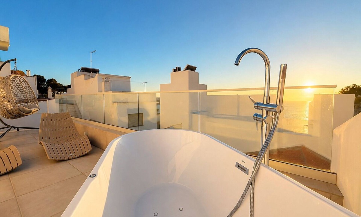 Alvor House | Enjoy exclusive use of two beautifully refurbished townhouses combined into one spacious 4-bedroom home in Alvor Old Town. Steps from the harbour, beach and restaurants, with sunny sea-view terraces jacuzzi, 2living rooms, 2kitchens, AC throughout.