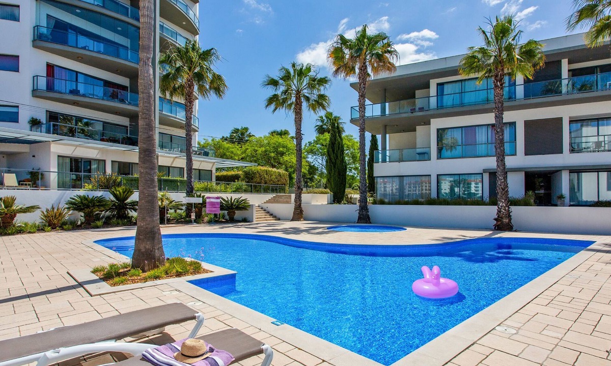 Quarteira Apartment | Experience ultimate relaxation in Quarteira's beachfront paradise.