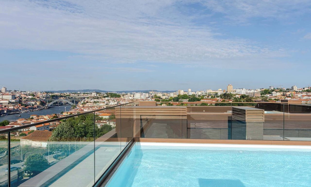 Santa Marinha Apartment | Premium Flat w/Rooftop Pool & Garage by HostWise