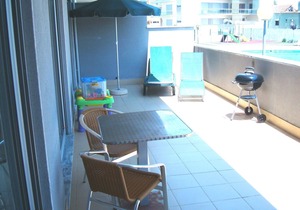 Modern apartment with pool, large private terrace, 3 minute walk to beach