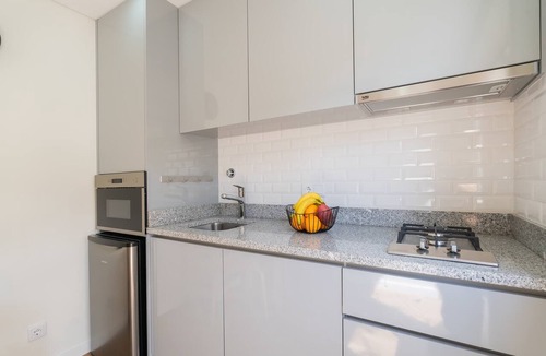 Maia Apartment | Cozy Studio with Pool Near Airport by HostWise