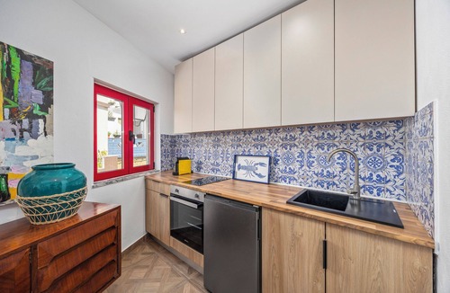 Alvor House | Enjoy exclusive use of two beautifully refurbished townhouses combined into one spacious 4-bedroom home in Alvor Old Town. Steps from the harbour, beach and restaurants, with sunny sea-view terraces jacuzzi, 2living rooms, 2kitchens, AC throughout.