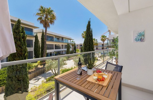 Quarteira Apartment | Experience ultimate relaxation in Quarteira's beachfront paradise.