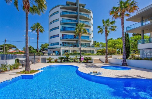 Quarteira Apartment | Experience ultimate relaxation in Quarteira's beachfront paradise.