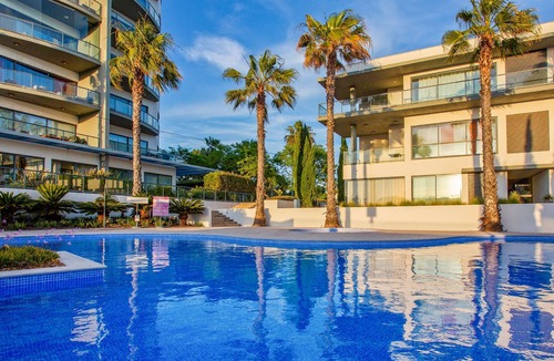 Quarteira Apartment | Experience ultimate relaxation in Quarteira's beachfront paradise.
