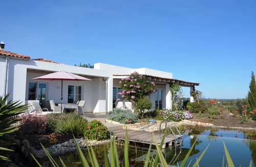Quelfes House | Luxurious vacation home with natural pool and sea view