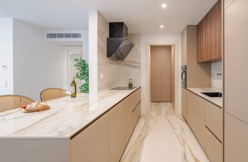 Santa Marinha Apartment | Luxury Living w/Rooftop Pool & Garage by HostWise