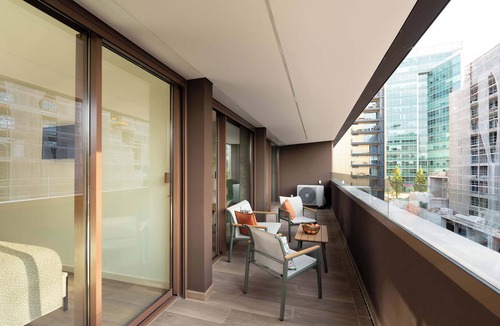 Santa Marinha Apartment | Luxury Living w/Rooftop Pool & Garage by HostWise