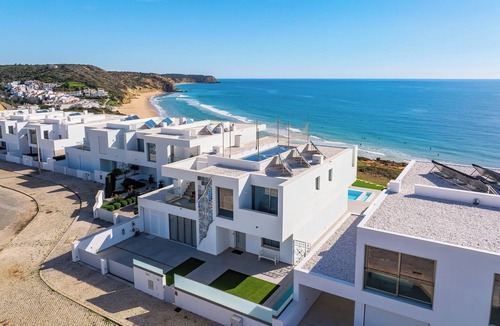 Salema Villa | Ocean Front Algarve. Chic, modern villa with two pools in quaint fishing village
