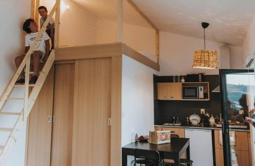 Peso Apartment | Premium 30 m² suite for up to 4 guests, with private bathroom, kitchenette and mezzanine. Nespresso, Marshall sound system and robes. Shared seasonal pool, garden and outdoor areas. Free gated parking. Pets: €7/night.