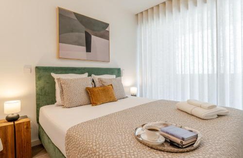Santa Marinha Apartment | Premium Living with Pool, Balcony, Gym & Garage by HostWise