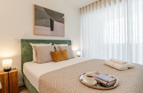 Santa Marinha Apartment | Premium Living with Pool, Balcony, Gym & Garage by HostWise
