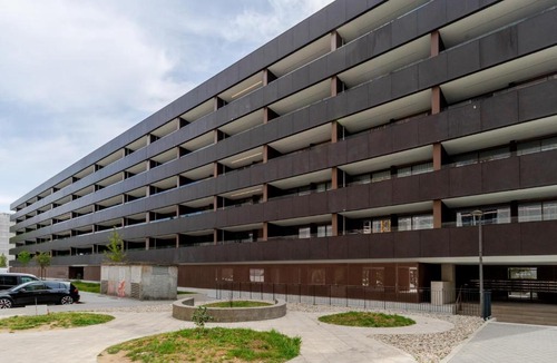 Santa Marinha Apartment | Premium Living with Pool, Balcony, Gym & Garage by HostWise