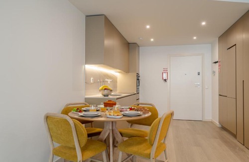 Santa Marinha Apartment | Premium Living with Pool, Balcony, Gym & Garage by HostWise