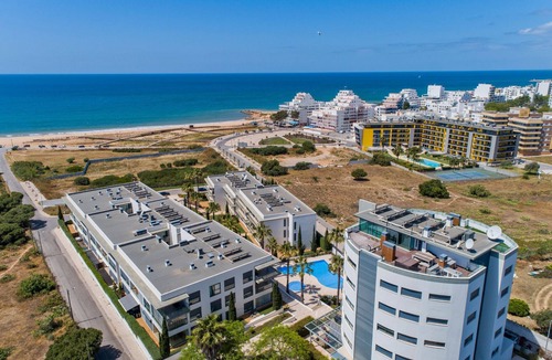 Quarteira Apartment | Relax by the pool at this Algarve apartment gem.