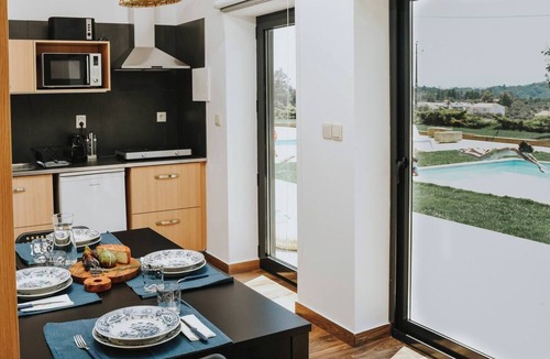 Peso Apartment | Spacious for 2 adults and 3 children, with mezzanine, star projector and baby kit (chair, crib, inflatable tub). Large window faces the pool, giving natural light, relaxing view and direct outdoor access—perfect for family comfort.