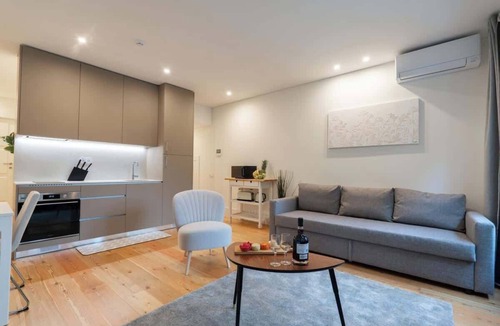 Oliveira do Castelo Apartment | Sunny Flat w/Balcony by Host Wise