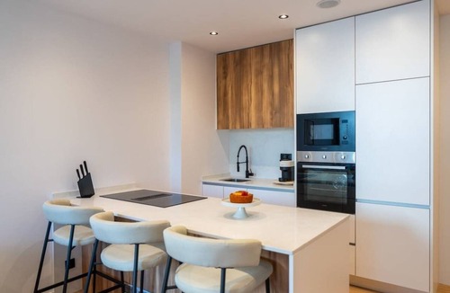 Bonfim Apartment | Urban Terrace & Stylish Living Spaces by HostWise