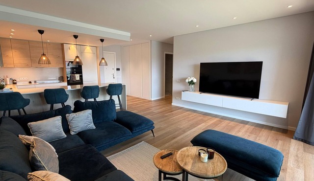 Brand new luxury apartment in charming Quarteira condominium with AC and pool.