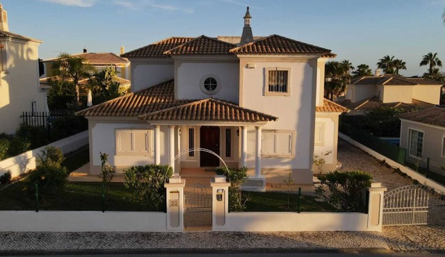 Modern villa with heated pool near the beach and golf course