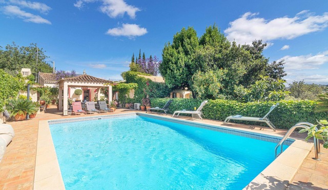 Private Algarve oasis with pool, 3 houses, and garden in loule