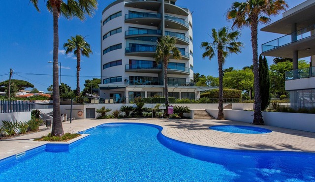 Relax by the pool at this Algarve apartment gem.