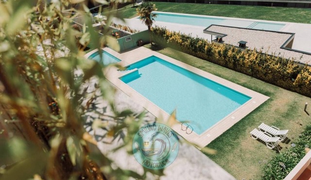 Smiling Waves Apartment with Shared Pool, Private Rooftop Terrace, and Wi-Fi in Fão