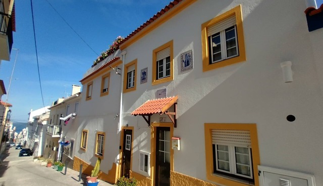 Traditional beach house featuring Portuguese handicrafts