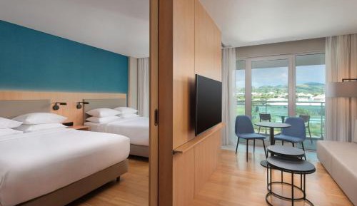 Junior Queen Suite with Two Queen Beds and Balcony - Mountain View